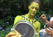 A woman is made up during the third annual NYC Bodypainting Day. The artist behind the event, Andy Golub, is planning an event to paint 200 nude models in Times Square next month.