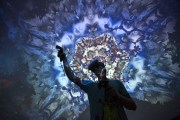 A man tries out a virtual reality game inside a Fulldome.pro 360-degree projection dome on opening day of the Electronic Entertainment Expo at the Los Angeles Convention Center on June 13, 2017, in Los Angeles, California. The computer and video game trade show draws an international crowd of industry members and fans.