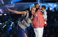 Host Katy Perry (L) and DJ Khaled speak onstage during the 2017 MTV Video Music Awards at The Forum on Aug. 27, 2017, in Inglewood, California.