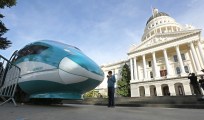 FILE - In this Feb. 26, 2015, file photo, a full-scale mock-up of a high-speed train is displayed at the Capitol in Sacramento, Calif. The California Supreme Court is set to issue a ruling that could have big implications for the state