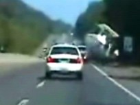 Watch This!  Boat Out of Water Crashes on Interstate