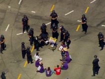 Janitors' Protest Leads to 13 Arrests