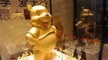 This March 22, 2012, file photo shows a gold figure of Winnie The Pooh displayed at a jewelry store in Chengdu, China. But images and mentions of the character on social media seem to have fallen afoul of censors in the nation in July 2017.