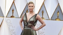 Charlize Theron arrives at the Oscars on Sunday, Feb. 26, 2017, at the Dolby Theatre in Los Angeles.