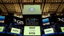 NEW YORK, NY - MARCH 2: Signage for Snap Inc., parent company of Snapchat, is displayed on monitors on the floor New York Stock Exchange (NYSE) before the opening bell, March 2, 2017 in New York City. Snap Inc. priced its initial public offering at $17 a share on Wednesday and Snap shares will start trading on the New York Stock Exchange (NYSE) on Thursday. (Photo by Drew Angerer/Getty Images)