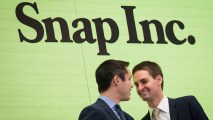 In this March 2, 2017 file photo, Snapchat co-founders Bobby Murphy, chief technology officer of Snap Inc., and Evan Spiegel, chief executive officer of Snap Inc., smile at each other after ringing the opening bell at the New York Stock Exchange (NYSE).