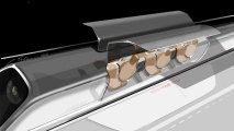 This undated conceptual design rendering provided by SpaceX shows a Hyperloop passenger transport capsule, at a station ready to take on passengers. Three Southern California companies plan to build tracks to test how well the speed-of-sound transportation concept known as the "hyperloop" works in the real world.