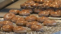 This March 15, 2002, file photo shows Krispy Kreme original glazed doughnuts at a shop in Rosemont, Illinois.