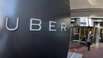 In this Dec. 16, 2015, file photo, a man leaves the headquarters of Uber in San Francisco. The company has added a new function to its app to help users easily retrieve lost items by meeting up with their driver.
