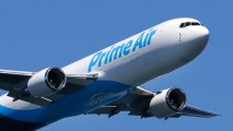 In this Aug. 5, 2016 file photo, a Boeing 767 with an Amazon.com "Prime Air" livery flies over Lake Washington as part of the Boeing Seafair Air Show.