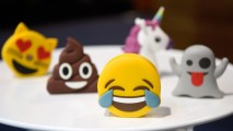 In this January 6, 2017, file photo, batteries designed as emojis are displayed at a booth at CES 2017 in Las Vegas. Facebook released statistics about emoji usage on its platform to mark World Emoji Day on July 17.