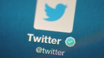 In this November 7, 2013 photo illustration, The Twitter logo is displayed on a mobile device. Llia Apostolou and Paul Gibson of London married almost three years after meeting over the social media platform and joking about getting married.