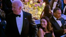 Actress Julia Louis-Dreyfus, right, smiles as he takes her seat next to Vice President Joe Biden, left, at a State Dinner for French President Francois Hollande, Tuesday, Feb. 11, 2014, on the South Lawn of the White House in Washington. Biden recently sent Louis-Dreyfus best wished following cancer revelation.