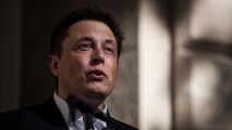 Elon Musk speaks at an event in September 2014. The CEO of Tesla Motors has announced plans to test a 5-mile track of Hyperloop, which he described as "a cross between a Concorde and a railgun and an air hockey table."