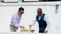 Mayor Robert Garcia of Long Beach and John Jenkins, the Vice President of Asset Management at Urban Commons placed the first brushstrokes of paint upon the famous ocean-liner on Monday, July 10.