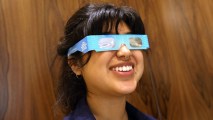 Karolyna Landin poses with a pair of solar eclipse glasses in New York City. Where will you be on the morning of Aug. 21, 2017? Kidspace has a JPL-tastic party on. (Photo by Spencer Platt/Getty Images)