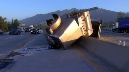 Big Rig Carrying Grapes Crashes Into Freeway Divider