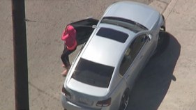 Pink Hoodie-Clad Driver Narrowly Avoids Hitting Girl During Chase