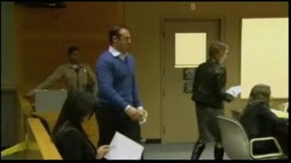 Former School Cop Makes Court Appearance, Assists Photographer