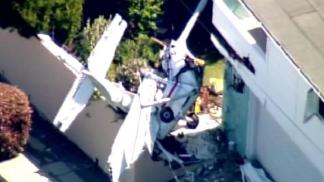 Pilot Rescued from Plane Wreckage