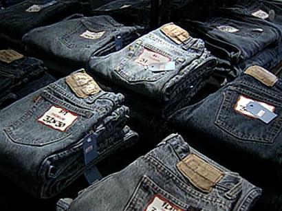 A man is arrested and charged with trademark counterfeiting after police find nearly 1,000 pairs of fake pricey jeans in his van during a traffic stop. A man is arrested and charged with trademark counterfeiting after police find nearly 1,000 pairs of fake pricey jeans in his van during a traffic stop.