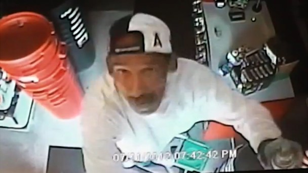 Burglar Caught on Tape Spraypainting Security Camera