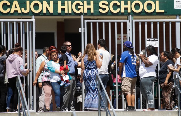 [la gallery] Photos: Students Evacuated, Reunited With Parents After San Benardino School Shooting