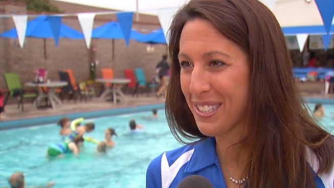 Olympian Janet Evans was at a swim club in Tustin Thursday to coach swimmers as part of the global &quot;World&#39;s Largest Swimming Lesson.&quot; - janetevans