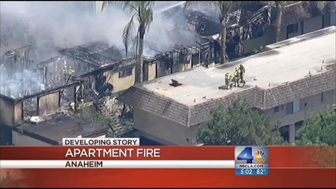 Firefighters responded to a three-alarm fire at the Villa Regina Apartments in Anaheim at 1:44 p.m. Friday. The fire was under control in 30 minutes, but four units were completely destroyed and other nearby buildings also sustained damage. A resident says the blaze began in her kitchen. Vikki Vargas reports from Anaheim for the NBC4 News at 5 p.m. on August 3, 2012.