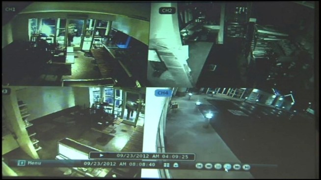 Beverly Hills police release a surveillance video that shows a burglar smashing through a glass door of a business in Beverly Hills on Sept. 22, 2012.