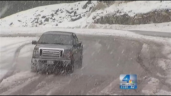 A widespread wintry mix dumped snow, heavy rain and wind across Southern California. Streets flooded in Moreno Valley and Running Springs was blanketed with snow, while the storm also awakened a 7-foot 