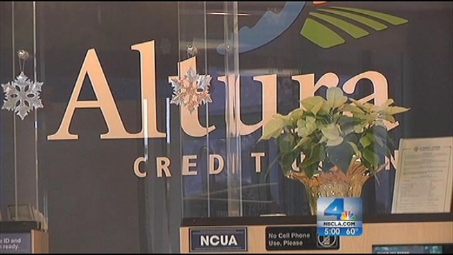 Dozens of cars were stopped on the northbound side of the Harbor (110) Freeway Friday while police searched for robbery suspects. Three armed robbers had made out with bags of money from the Altura Credit Union in Moreno Valley. Police narrowed in on the suspects through a tracking device in the bags. Lucy Noland reports for the NBC4 News at 5 p.m. on Dec. 21, 2012.