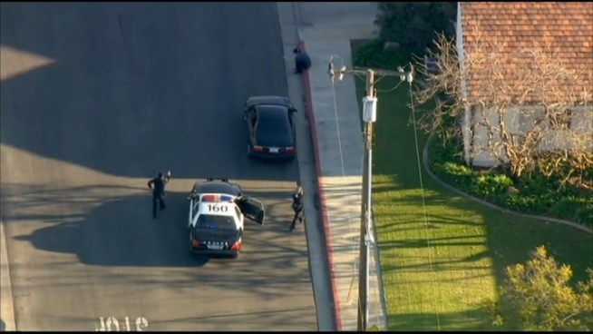 A pursuit through the streets of Santa Monica and Venice ended when the driver got out of his black sedan, hands up, smoking a cigarette. Raw video from NewsChopper 4 on Jan. 17, 2013.