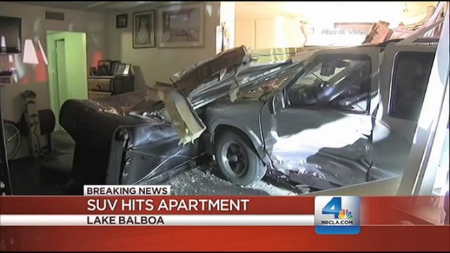 The vehicle hit a building, crashing into an apartment on Vanowen Street in Lake Balboa, on Saturday night. Robert Kovacik had details on the NBC4 News at 11 p.m. on Feb. 2, 2013.