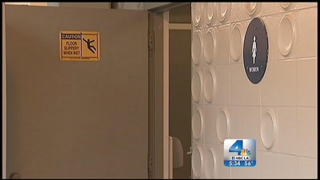 A postal worker who allegedly attacked an 11-year-old girl after she laughed at him when the mail carrier entered the wrong park restroom pleaded not guilty Wednesday to two misdemeanor counts. Robert Kovacik reports from East LA for the NBC4 News at 5 p.m. on Feb. 6, 2013.