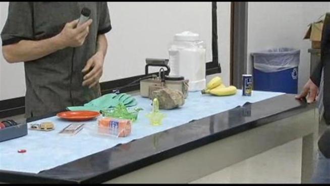 College professors show the geiger counter readings on some common items as a way of diffusing the concern about minute amounts of radiation coming from Japan.