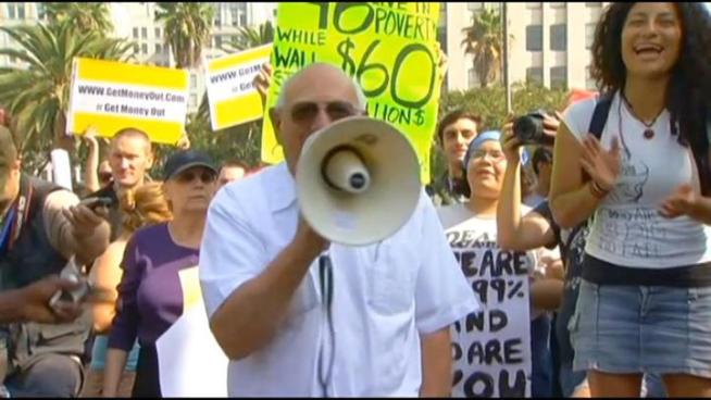 Thousands marched from Pershing Square to City Hall in what was billed as the 'Occupy Los Angeles Global Day of Action.' The march drew many young protesters, as well as some who've been demonstrating for decades.