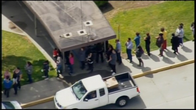 Deputies search a Whittier neighborhood following a fatal shooting that prompted lockdowns at three nearby schools.
