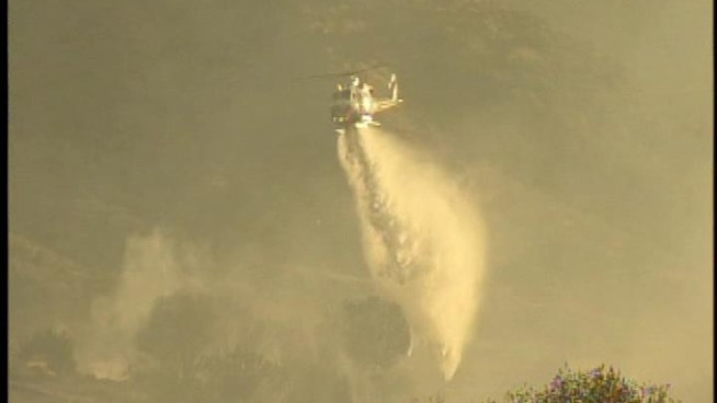 Firefighters Tuesday made progress against a wildfire that burned at several structures in the Acton area of Los Angeles County.  Beverly White reports from Acton for NBC4 News at 11 p.m. on May 8, 2012.