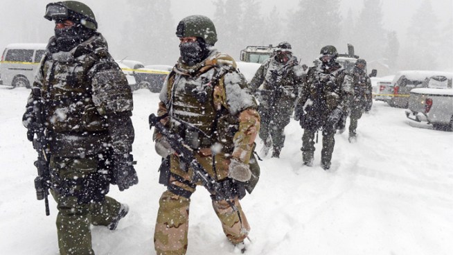 SWAT teams continued searching door to door Friday in search for murder suspect and former LAPD Officer Christopher Dorner. Big Bear Lake residents say they are on edge as the second day of the search winds down. Whit Johnson reports from Big Bear for the NBC4 News at 5 and 6 p.m. on Feb. 8, 2013.