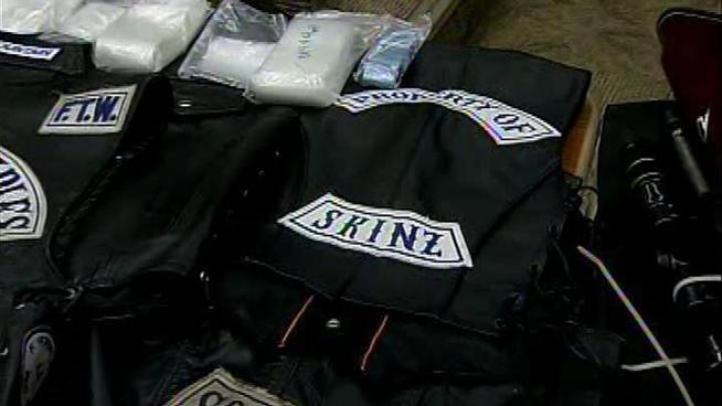 Authorities are searching for a teacher at Cal State San Bernardino, who they say, was the leader of a drug ring, and a motorcycle gang.