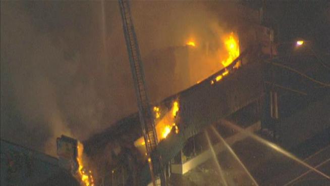 Federal ATF agents joined local police departments Friday to investigate an early morning three-alarm fire that damaged a tobacco wholesale business in Burbank. Toni Guinyard reports for the NBC4 News at Noon on November 9, 2012.
