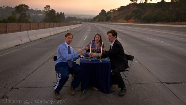 Two couples were looking for something to do during Carmageddon. When the freeway shut down, they climbed a hill and hopped some fences... and set the table for a most memorable photo op.