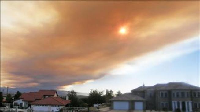 Flames continued to burn 4,000 acres in the San Gabriel Mountains just north of Azusa on Monday, more than 24 hours after it began.  Stephanie Elam reports from Glendora for the NBC4 News at 5 p.m. on Sept. 3, 2012.
