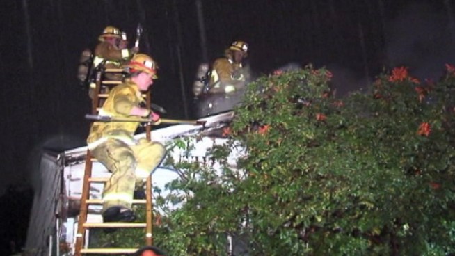 A neighbor describes watching a Mar Vista house catch fire after a lightning strike early Friday. Firefighters knocked down the fire in about 15 minutes amid the overnight storm. Raw video from Friday March 8, 2013.