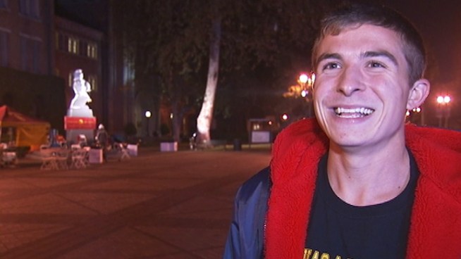 USC's Taylor Hellam watches for any signs of suspicious Bruin activity as he guards Tommy Trojan at USC during the overnight shift. Hellam talks about what it takes to keep the statue safe.