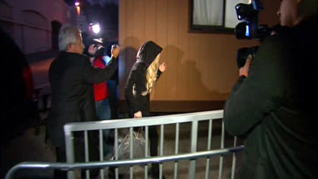 Wearing a hoodie, Lohan showed up before 6am for her community service at the morgue.