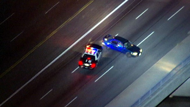 An officer applies a pursuit intervention technique to end a pursuit early Monday in the San Fernando Valley. Raw Aerial Video