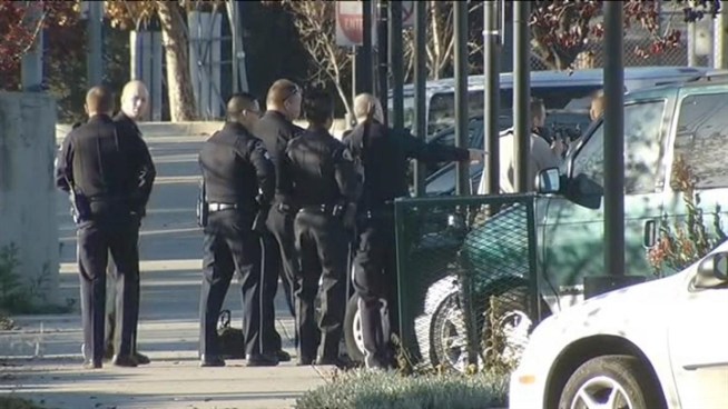 Police, hostage negotiators and SWAT members were on the scene of an armed naked man demanding police kill him Tuesday morning.