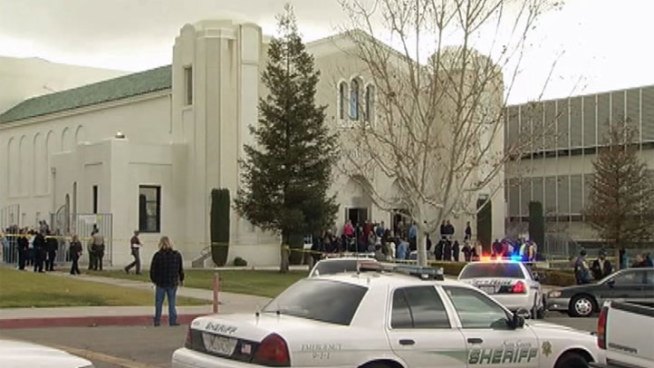 A student at Taft High School chokes up with tears as she remembers her 16-year-old classmate open fire in a classroom this week. Police are investigating reports that the boy had compiled a 